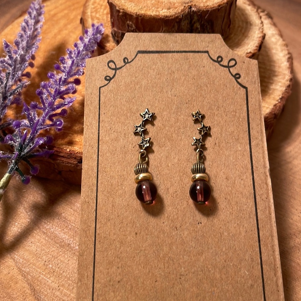 Women’s cute Jody, coyote, Garnet, and gold star earrings